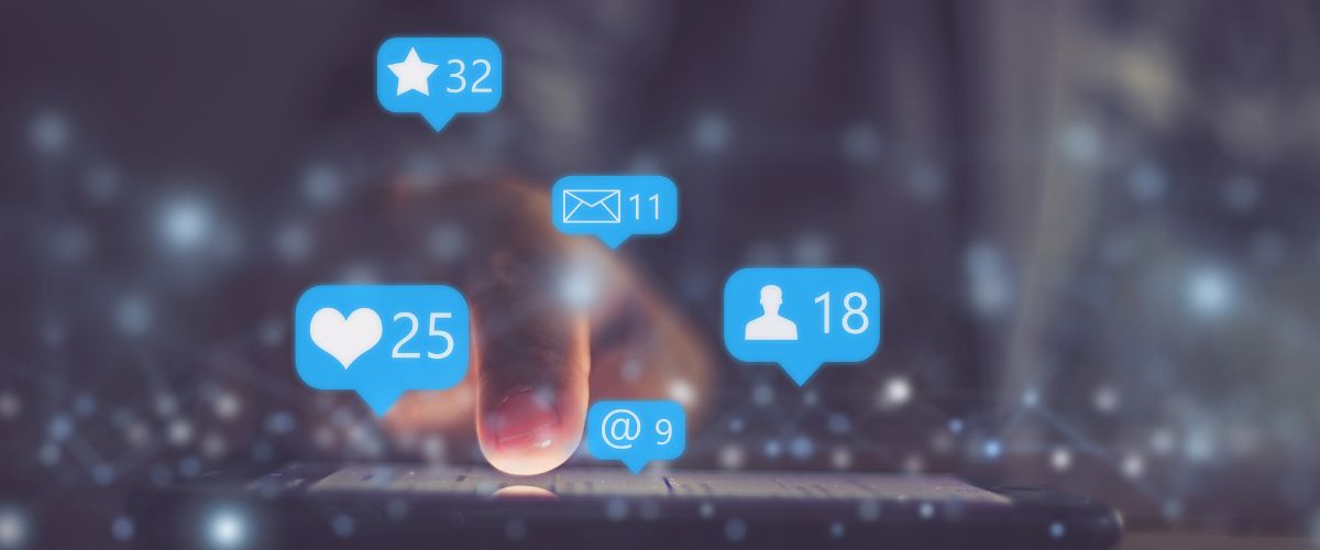 A hand interacts with a smartphone, surrounded by social media notification icons